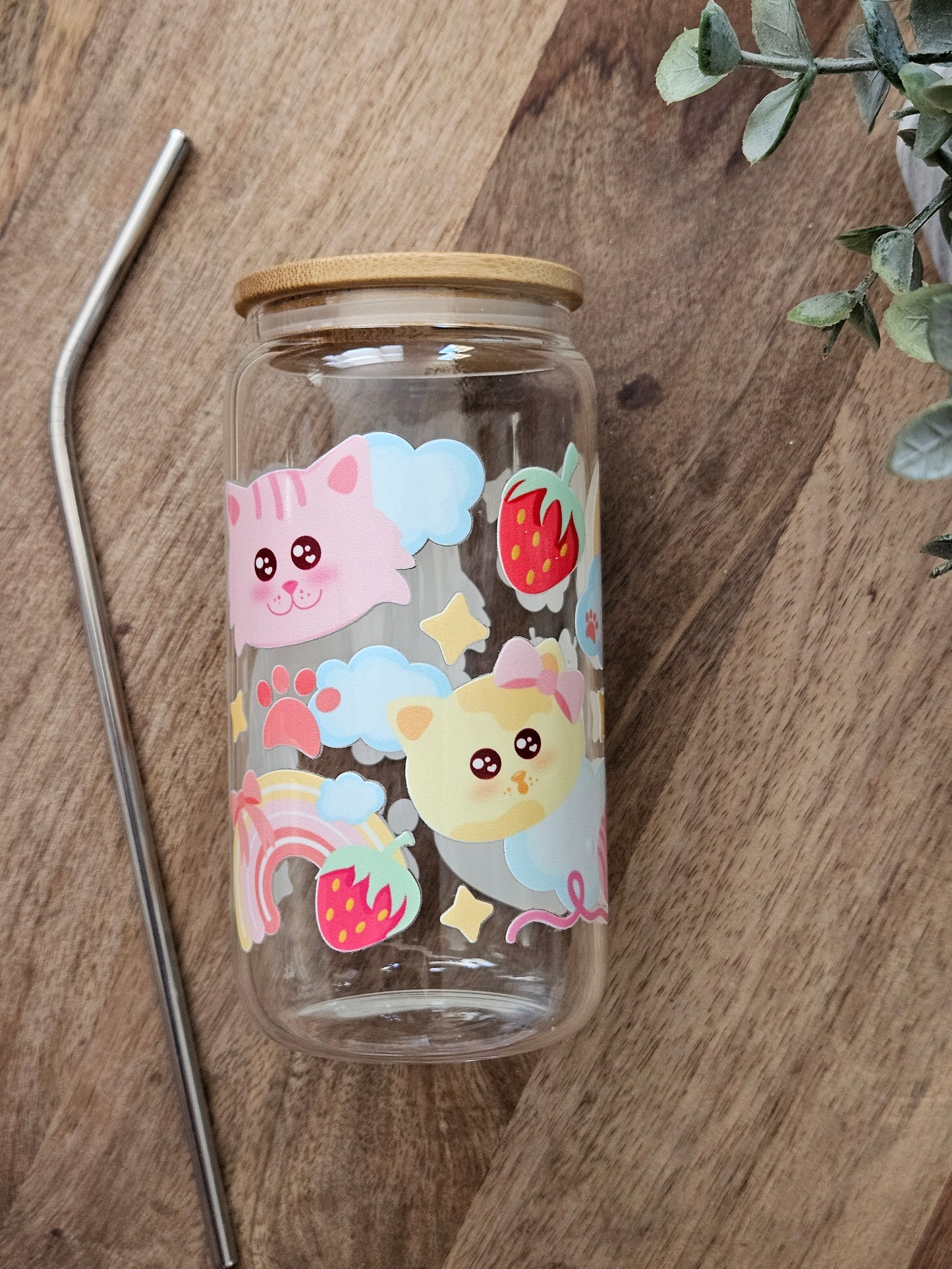 Sip your favorite drink in style with our Cat Rainbows Glass Cup! This adorable cup features a fun cat faces and is accented with a colorful rainbow design. Made of durable glass, it's both cute and functional. Perfect for any cat lover! Holds 16 oz , Hand wash only. Lid and Straw included